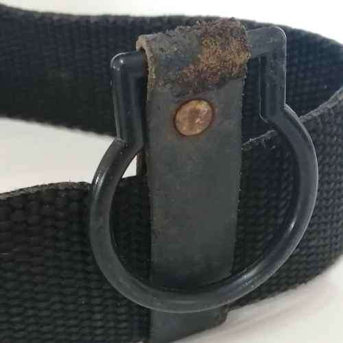 Black material tactical belt with baton holster