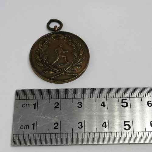 Vintage copper athletics medallion