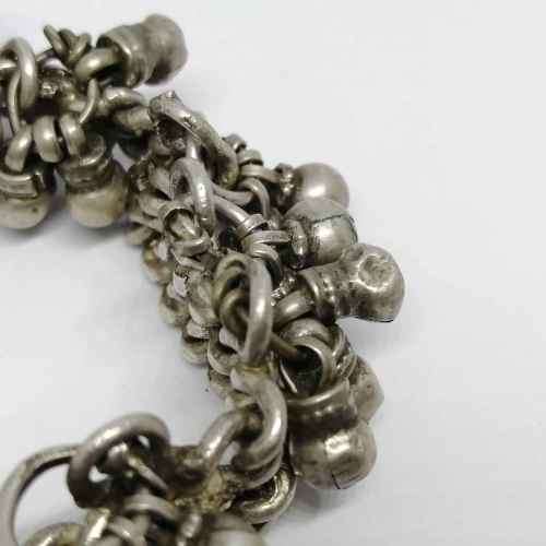 Low Grade silver bracelet with bells - weighs 107.7grams - lenght 23cm - one link broken