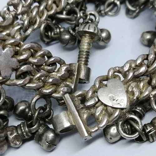 Low Grade silver bracelet with bells - weighs 107.7grams - lenght 23cm - one link broken