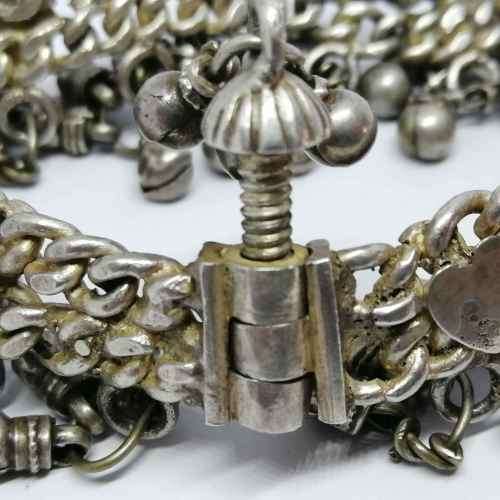 Low Grade silver bracelet with bells - weighs 107.7grams - lenght 23cm - one link broken
