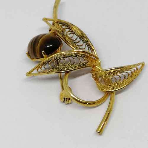 Gold colored fashion jewellery tigers eye brooch