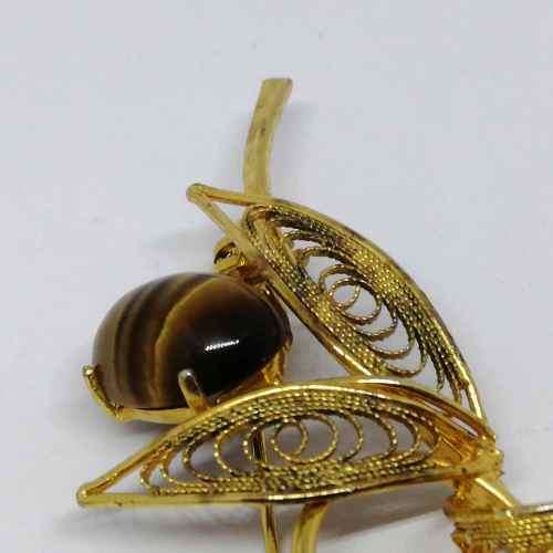 Gold colored fashion jewellery tigers eye brooch
