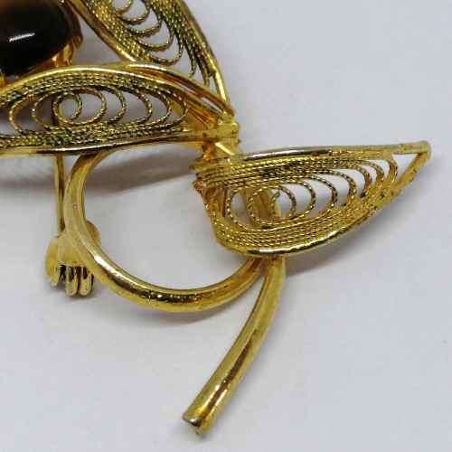Gold colored fashion jewellery tigers eye brooch