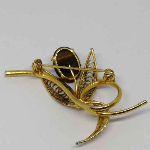 Gold colored fashion jewellery tigers eye brooch