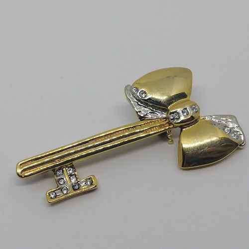 Gold colored fashion jewellery brooch