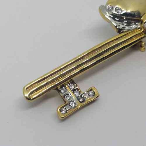 Gold colored fashion jewellery brooch