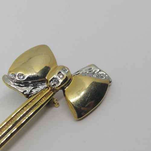 Gold colored fashion jewellery brooch