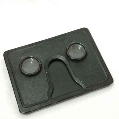 Antique metal case pocket stereo viewer with slides