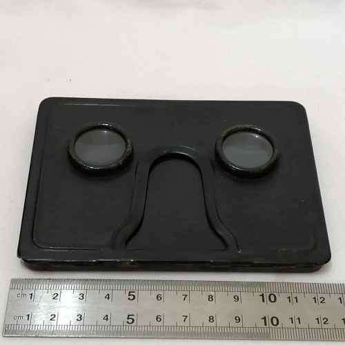 Antique metal case pocket stereo viewer with slides