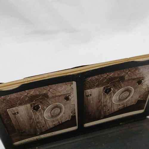 Antique metal case pocket stereo viewer with slides