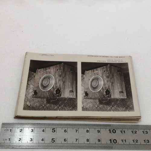 Antique metal case pocket stereo viewer with slides