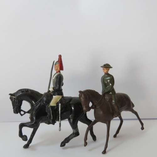 Pair of vintage cavalry troops lead soldiers