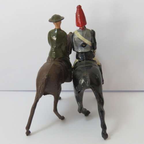 Pair of vintage cavalry troops lead soldiers
