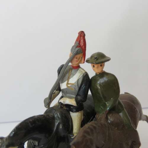 Pair of vintage cavalry troops lead soldiers