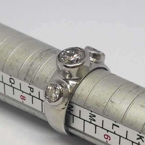 18kt White gold diamond ring with 1.2ct diamond and 2 smaller diamonds of 0.40ct -  weighs 7.0 grams