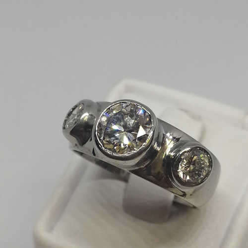 18kt White gold diamond ring with 1.2ct diamond and 2 smaller diamonds of 0.40ct -  weighs 7.0 grams