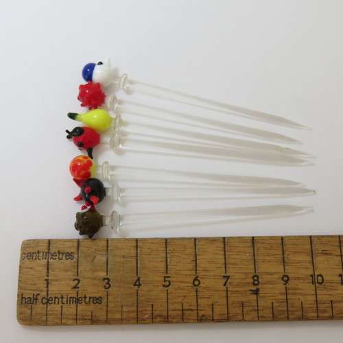 Lot of 7 vintage cocktail sticks of glass in small vase