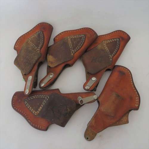 Lot of 10 leather holsters and straps for .32 and .38 revolvers