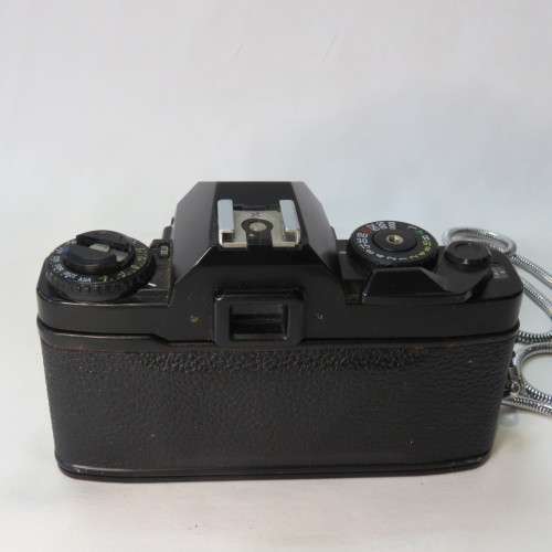 Ricoh KR-10 camera in pouch with Rikenon 1:2 50 mm lens and booklets