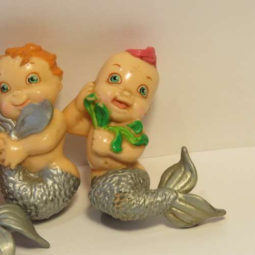 Pair of baby mermaid figurines