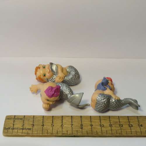 Pair of baby mermaid figurines