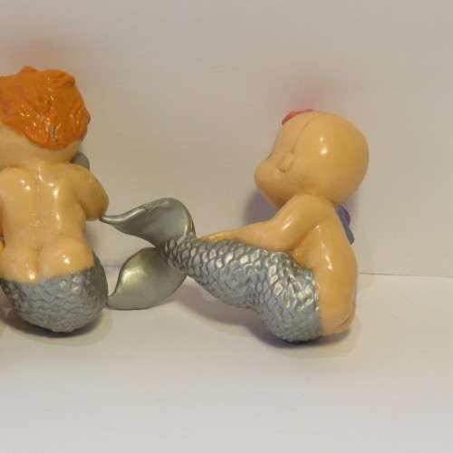 Pair of baby mermaid figurines