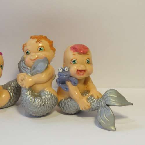 Pair of baby mermaid figurines