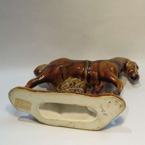 Pair of brown porcelain horses