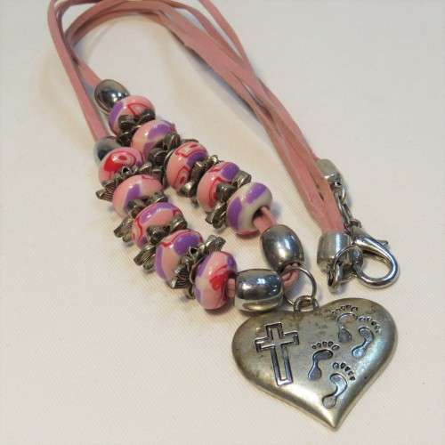 Costume jewellery pink necklace with cross pendant