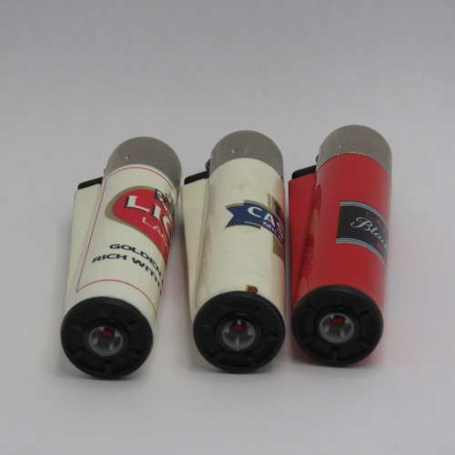 Set of Lion, Castle, Black Label refillable lighters