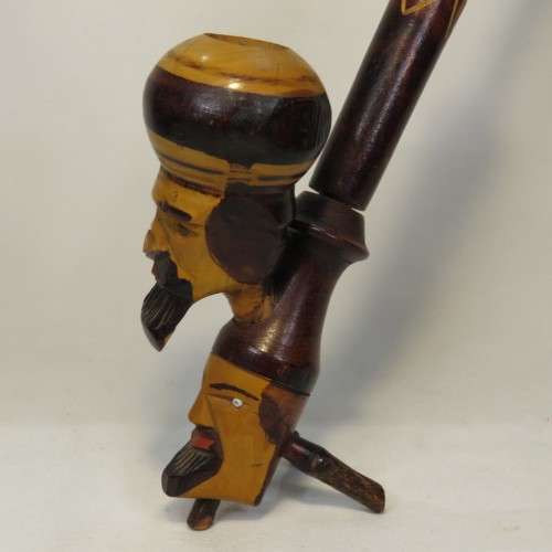Vintage long stemmed pipe with 2 faces