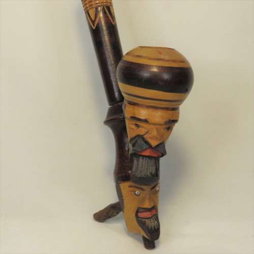 Vintage long stemmed pipe with 2 faces
