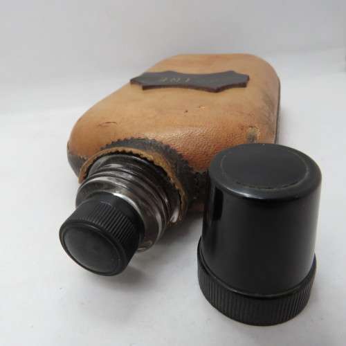 Vintage `Peine` glass hipflask with leather cladding