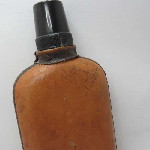 Vintage `Peine` glass hipflask with leather cladding