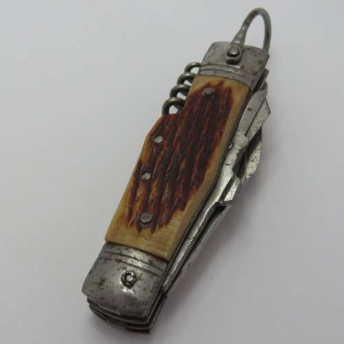 Small vintage pocket knife with corkscrew, Scissors, tin opener and blade - Unusual
