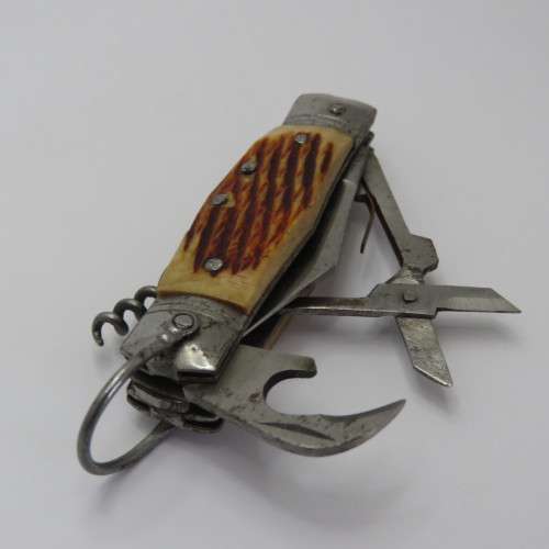 Small vintage pocket knife with corkscrew, Scissors, tin opener and blade - Unusual