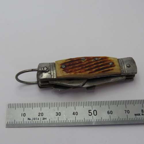 Small vintage pocket knife with corkscrew, Scissors, tin opener and blade - Unusual