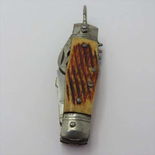 Small vintage pocket knife with corkscrew, Scissors, tin opener and blade - Unusual