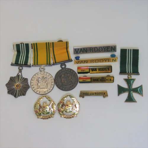Set of SA Prison Service medals and badges issued to Warrant officer RJ. Van Rooyen