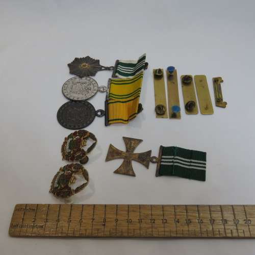 Set of SA Prison Service medals and badges issued to Warrant officer RJ. Van Rooyen
