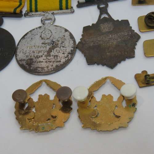 Set of SA Prison Service medals and badges issued to Warrant officer RJ. Van Rooyen
