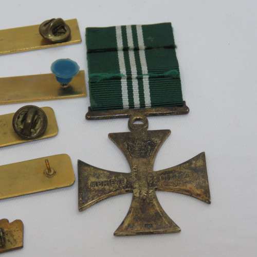 Set of SA Prison Service medals and badges issued to Warrant officer RJ. Van Rooyen