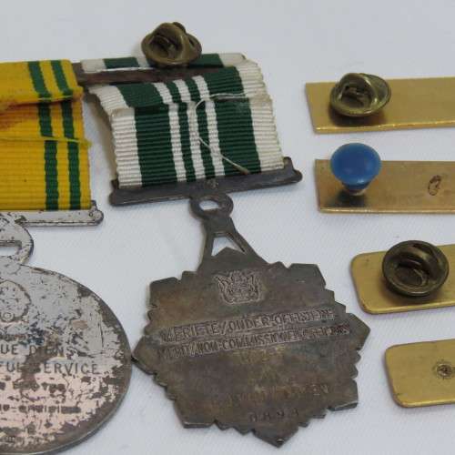 Set of SA Prison Service medals and badges issued to Warrant officer RJ. Van Rooyen