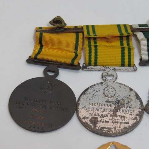 Set of SA Prison Service medals and badges issued to Warrant officer RJ. Van Rooyen