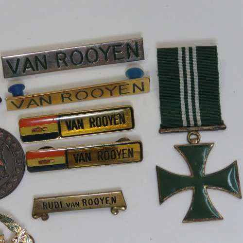 Set of SA Prison Service medals and badges issued to Warrant officer RJ. Van Rooyen