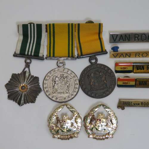 Set of SA Prison Service medals and badges issued to Warrant officer RJ. Van Rooyen