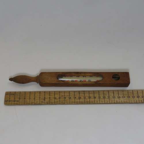 Vintage Thermometer in wooden stick
