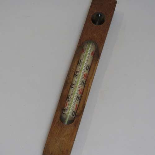 Vintage Thermometer in wooden stick