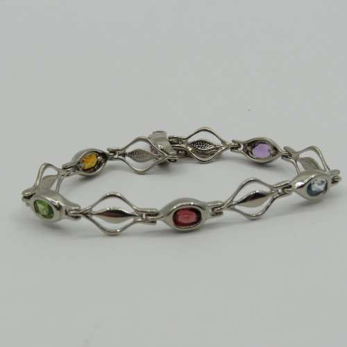 Lot of 5 silver look alike bracelets with colored stones - never used